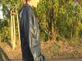 Get a Video with Sandra walking in her shiny nylon Rainsuit at a very hot and sunny day 5