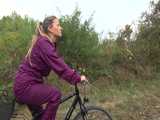 Get a Video with Sandra riding her bike enjoying her shiny nylon Rainwear 7