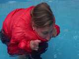 Watch Sandra enjoying the Pool during a hot summer Day with her shiny nylon Downjacket 7
