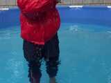 Watch Sandra enjoying the Pool during a hot summer Day with her shiny nylon Downjacket 8