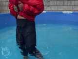 Watch Sandra enjoying the Pool during a hot summer Day with her shiny nylon Downjacket 9