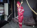 Watch Sandra bound gagged and noosed wearing her shiny nylon Rainwear 10