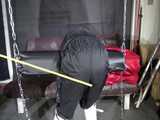 Watch Sandra beeing bound, gagged and spanked in her shiny nylon Rainsuit 5