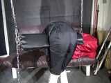 Watch Sandra beeing bound, gagged and spanked in her shiny nylon Rainsuit 7
