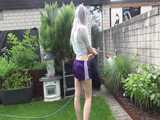 Get a video with Chloe enjoying gardening in her shiny nylon Shorts 6